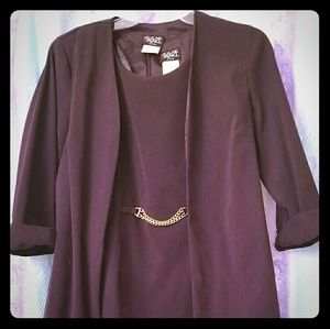 Two piece dress set with a chain in the middle.